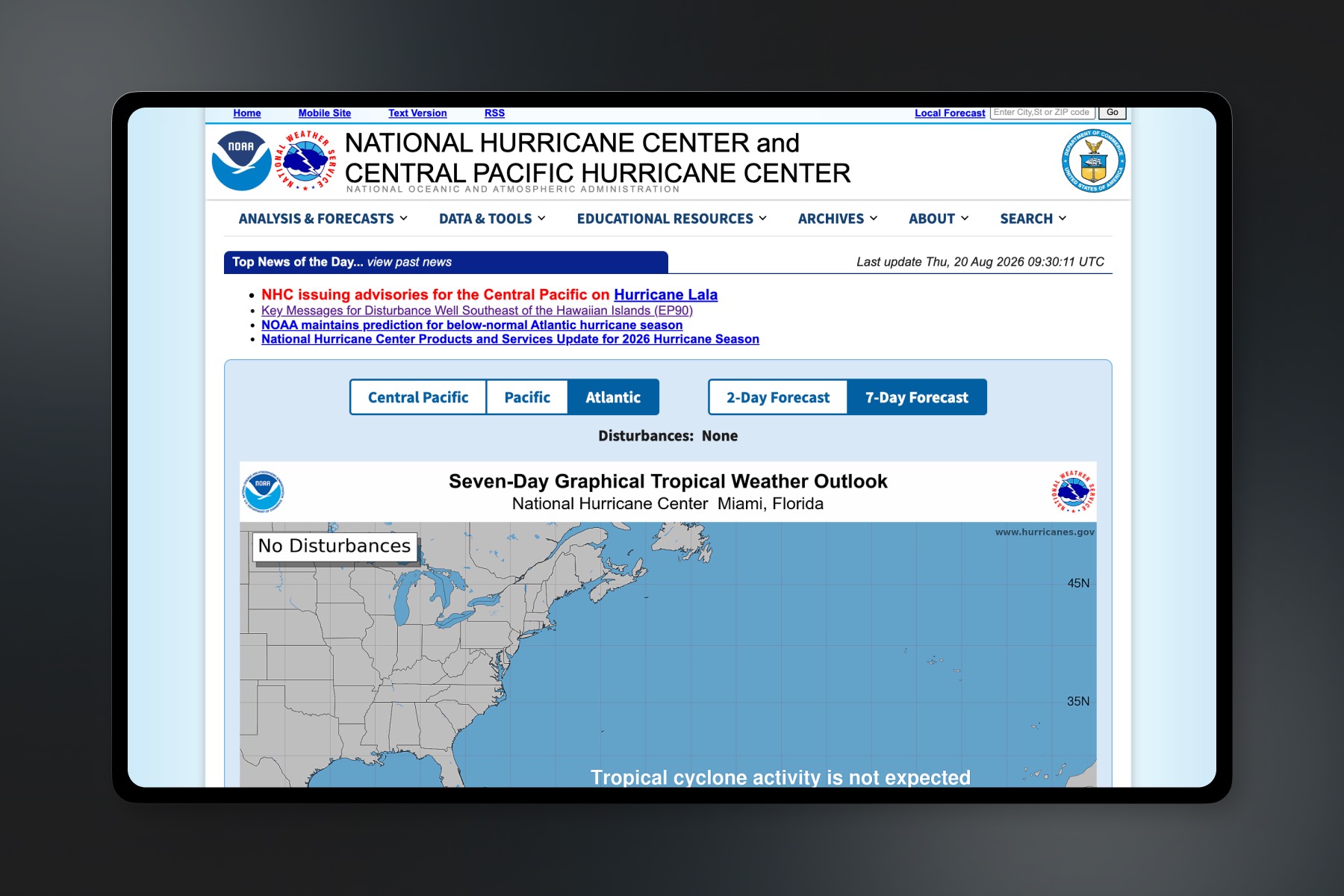 Before: the legacy National Hurricane Center homepage on a tablet. A pale blue page headed National Hurricane Center and Central Pacific Hurricane Center, with six dropdown menus, a “Top News of the Day” list of four text links, rows of buttons for selecting the Central Pacific, Pacific, or Atlantic basin and a two-day or seven-day forecast, and a static Seven-Day Graphical Tropical Weather Outlook map reading “No Disturbances”.