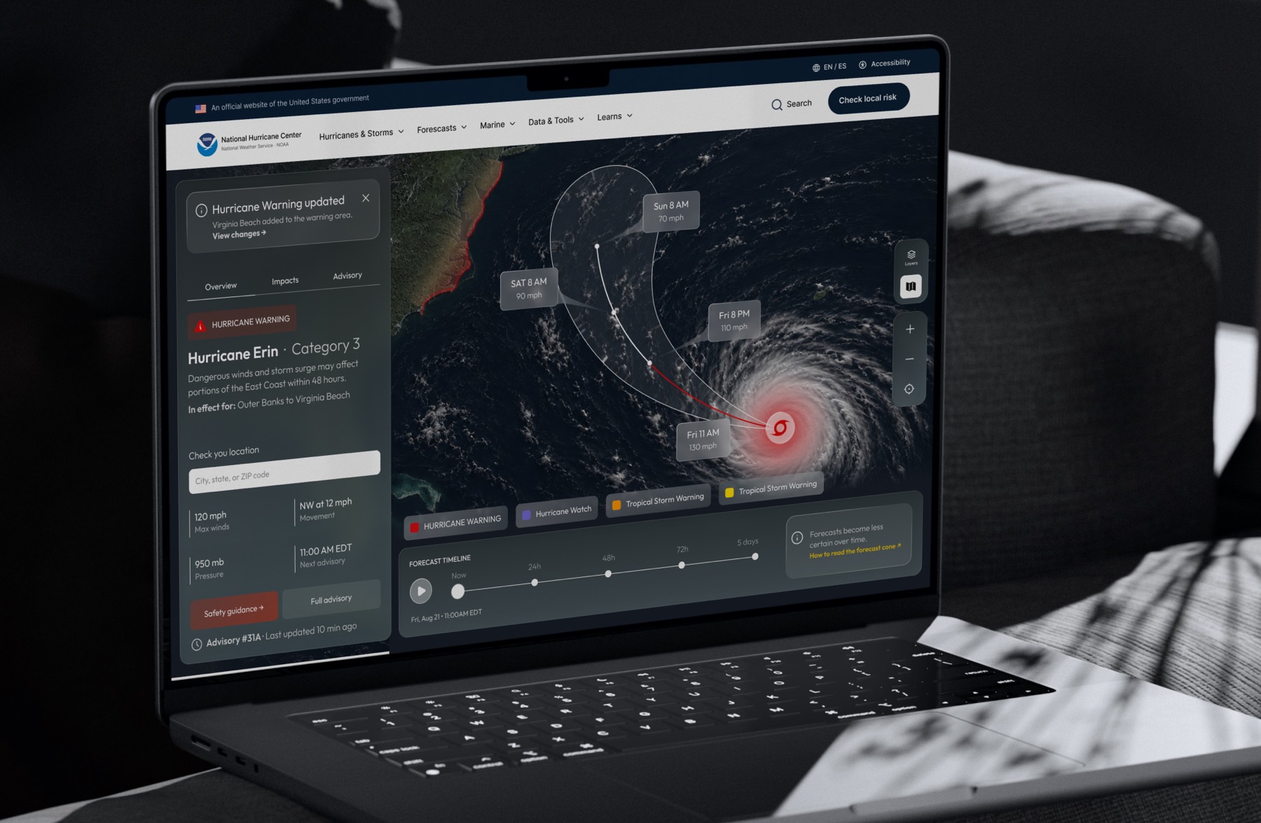 The redesigned National Hurricane Center open on a laptop. A dark satellite map fills the screen with a hurricane and its forecast track marked at Fri 11 AM, Fri 8 PM, Sat 8 AM, and Sun 8 AM. A panel on the left carries a Hurricane Warning label, the headline Hurricane Erin, Category 3, the area it is in effect for, a field to check your location, and readings for maximum winds, movement, pressure, and next advisory, above buttons for safety guidance and the full advisory.