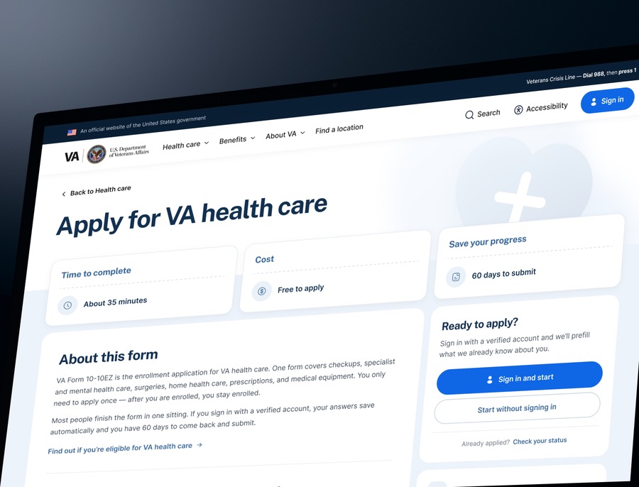 The redesigned “Apply for VA health care” page on a monitor — summary cards stating time to complete, cost, and how long progress is saved, beside a panel offering sign in and start or start without signing in.